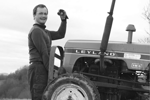 Man lifts tractor with one hand